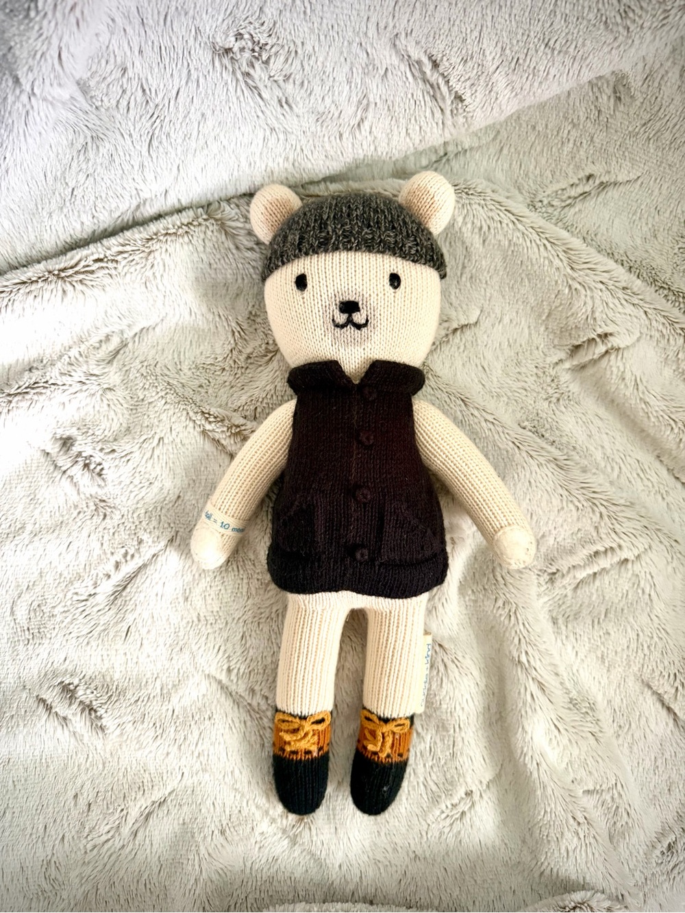 Cuddle + Kind Cream Knit Bear Plush with Gray Hat and Dark Brown Vest